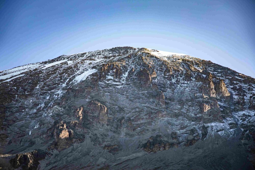 Uhuru Peak summit at 5,895m — the finishing point of all Kilimanjaro routes, Tanzania
