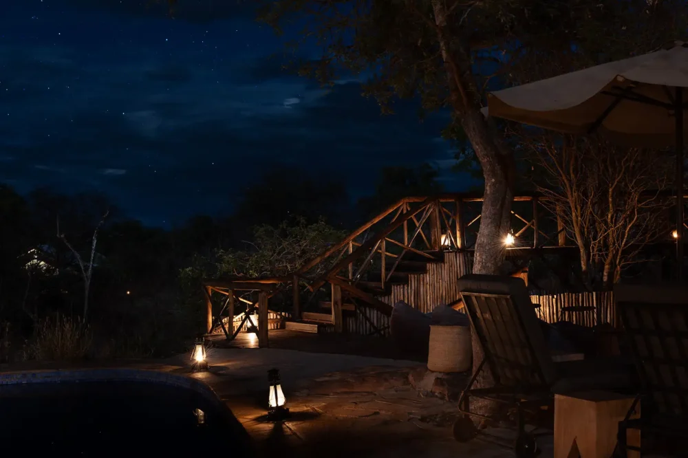 Luxury safari lodge illuminated at night in Serengeti National Park, Tanzania during a premium safari experience
