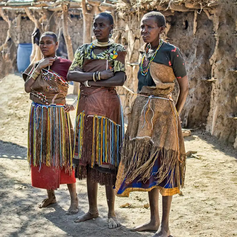 Meeting Datoga tribe women during a cultural tour in Tanzania, experiencing their traditions and traditional crafts near Lake Eyasi.