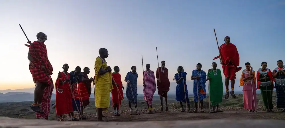 Maasai warriors perform a traditional dance in West Kilimanjaro, Tanzania, celebrating their rich cultural heritage against the backdrop of Africa's iconic landscapes.