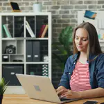 Woman completing a Tanzania eVisa application online before her trip
